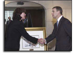 Laurette Koellner shaking hands with Prince Andrew