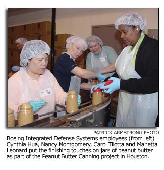 IDS employees canning peanut butter