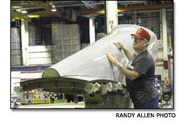 Ron Price cleaning a 747 strut