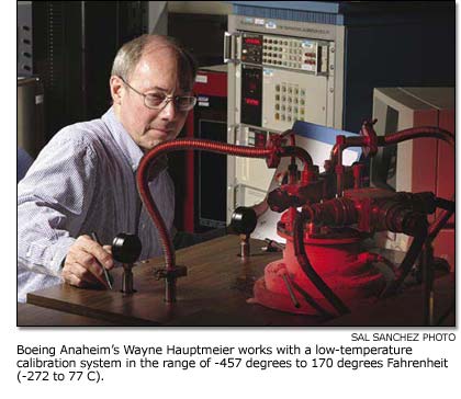 Wayne Hauptmeier works with a low-temperature calibration system