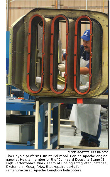 Tim Haynie performs structural repairs on an Apache engine nacelle.