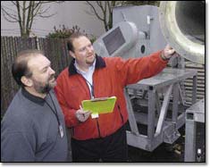 Mike Emerson and Gerry Croy examine a piece of surplus
equipment