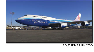 a 747-400 featuring a unique promotional paint scheme that combinines Boeing's new dynamic blue-and-white livery with China Airlines' traditional plum blossom tail marking