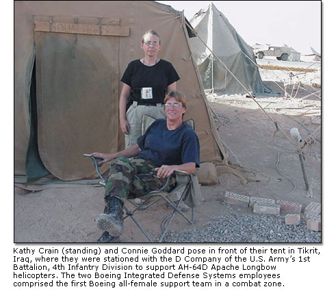 Kathy Crain and Connie Goddard pose in front of their tent in Tikrit, Iraq