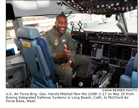 U.S. Air Force Brig. Gen. Harold Mitchell in the cockpit of the 120th C-17