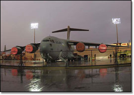 photo of the C-17 sitting on a wet tarmac