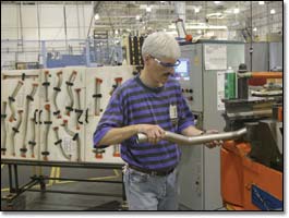 Doug Harper, automated cell technician, builds a thermal anti-icer that funnels hot air off the engines of a Boeing 737 into the wing’s leading-edge slats.