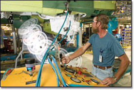 Dennis Collins tests the main landing gear hydraulic operation of an F-15K