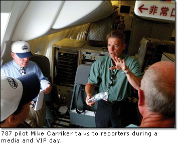 787 pilot Mike Carriker talks to reporters during a media and VIP day.