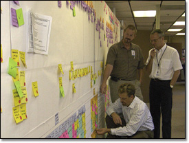 J.C. Langlois of Goodrich's Aerostructures division  consults with Bruce Bradfield of Boeing