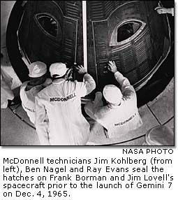 McDonnell technicians seal the hatches on the Gemini 7