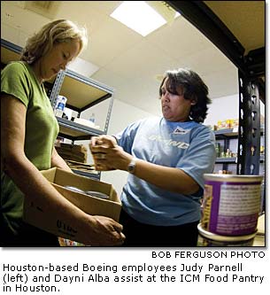 Judy Parnell and Dayni Alba assist at the ICM Food Pantry in Houston