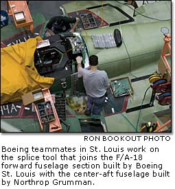 Boeing teammates in St. Louis work on the splice tool that joins the F/A-18 forward fuselage section