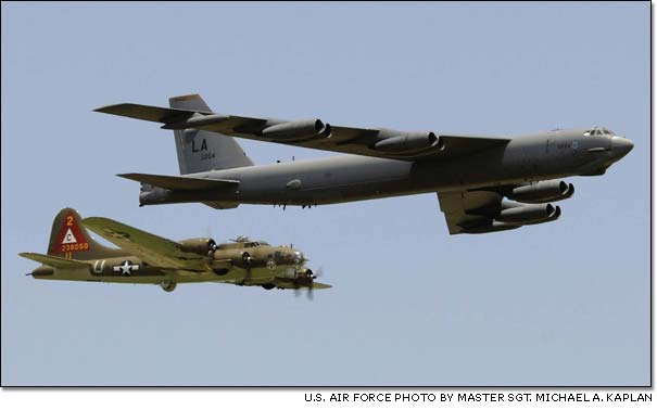 A B-17G Flying Fortress and a B-52H Stratofortress fly in a heritage flight formation