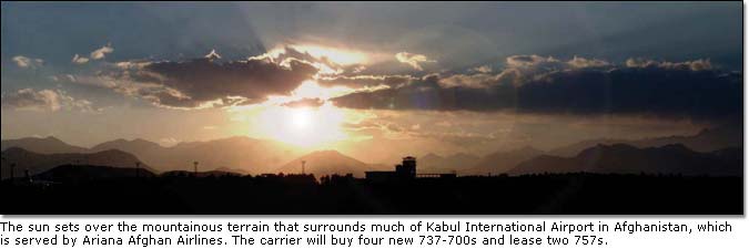 The sun sets over the mountainous terrain that surrounds much of Kabul International Airport in Afghanistan