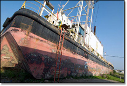 3,500-ton barge that housed an offshore power station was swept inland 